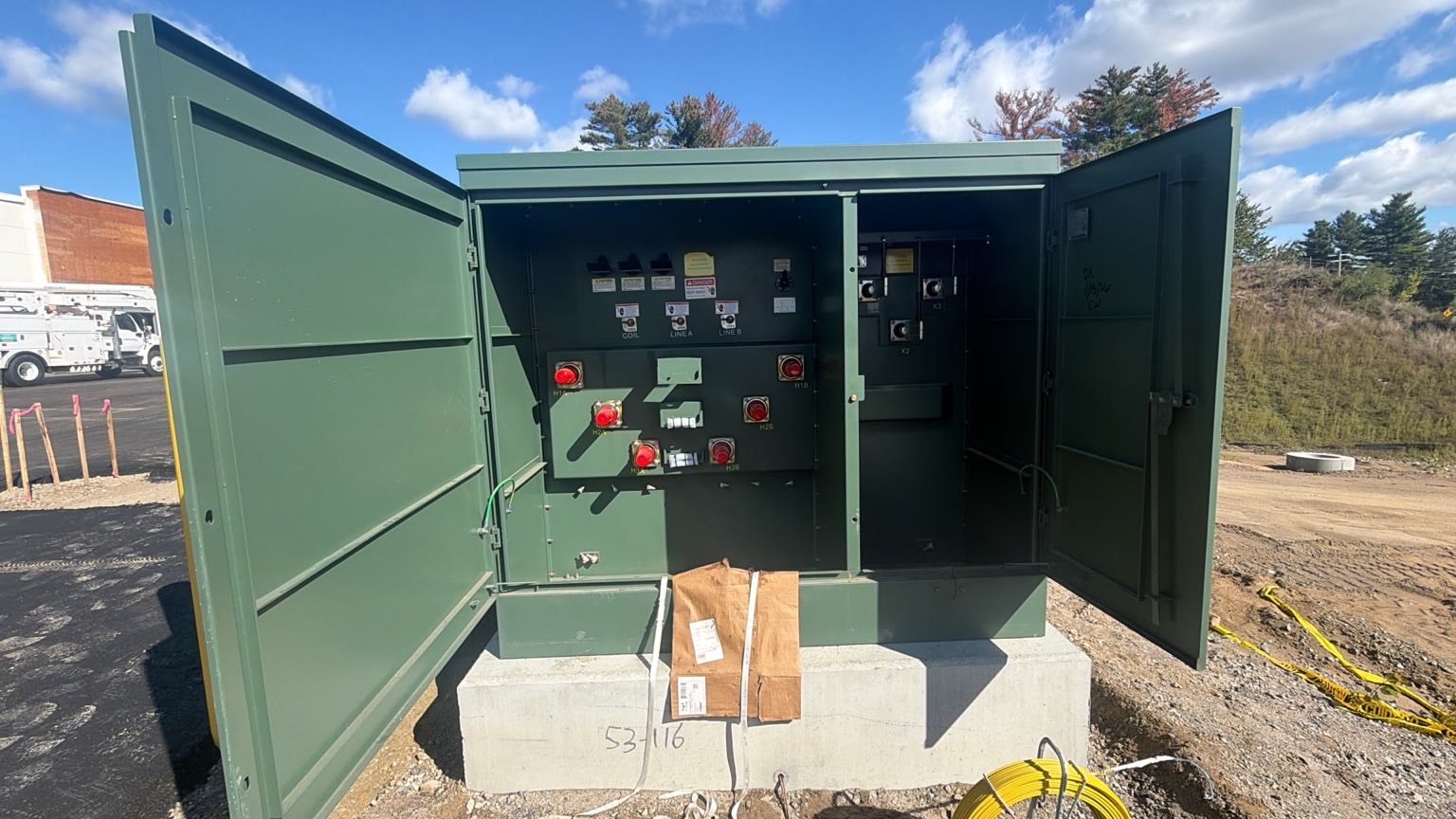 750 kVA pad-mounted utility transformer positioned on its completed concrete pad