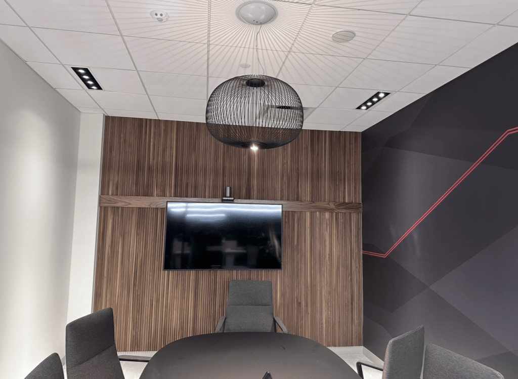 Finished conference room with integrated electrical and lighting