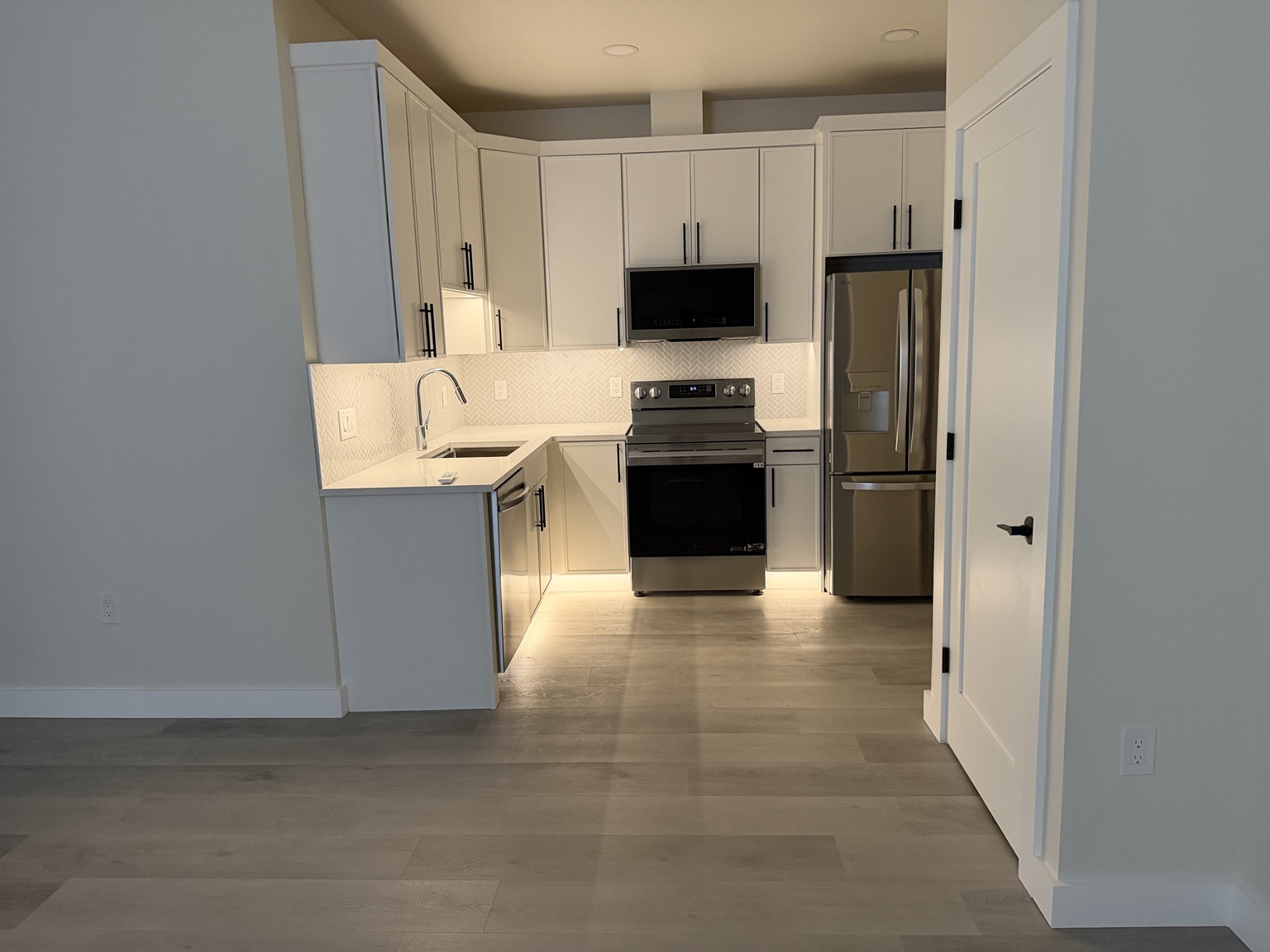 Completed multifamily kitchen electrical and under-cabinet lighting by Brens Electric
